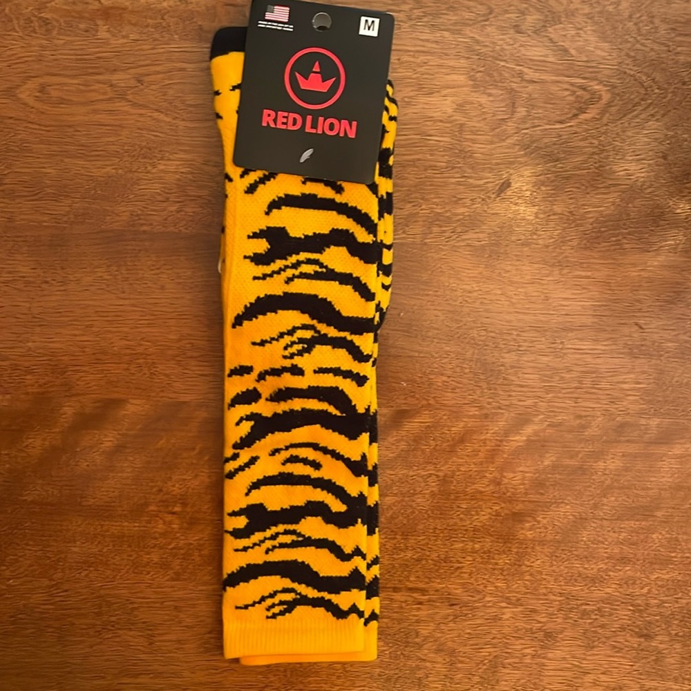 NWT. Soccer socks. Black & gold tiger print. Size 5-10 women, 4.5-8.5 men.
